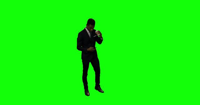 Businessman Wearing Suit Adjusting Tie Isolated on Green Screen - Download Free Stock Images Pikwizard.com