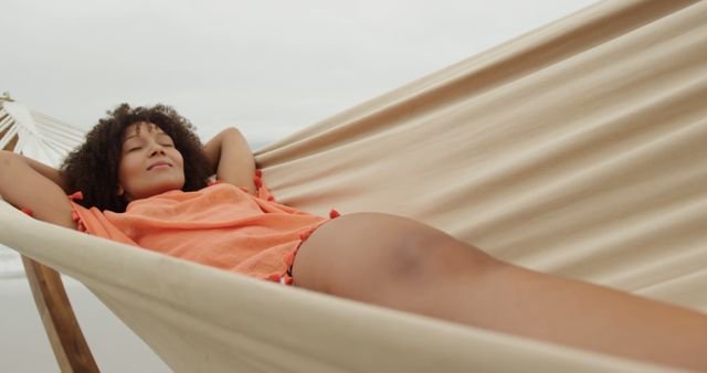 Relaxed Woman Lying on Hammock at Peaceful Beach - Download Free Stock Images Pikwizard.com