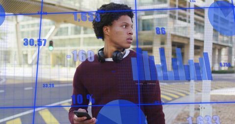 Young man navigating urban crosswalk with smartphone and headphones, digital data overlays