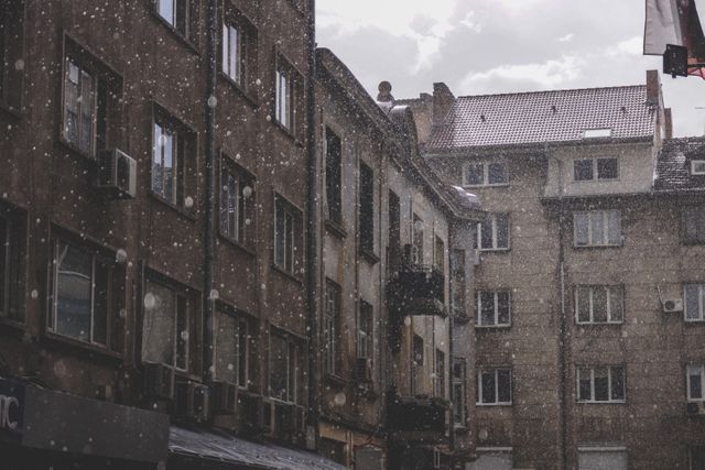 Rain Falling on Old Apartment Buildings on Cloudy Day - Download Free Stock Images Pikwizard.com