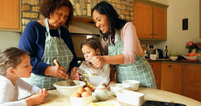 This image is perfect for illustrating the joy and bond of multigenerational families engaging in home cooking. It can be used in advertisements or articles about family activities, cooking together, cultural traditions, and home life. Suitable for websites or magazines focusing on family, food, or DIY home activities.