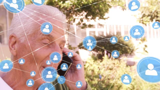 Depicts senior man engaging with smartphone amidst digital network icons, symbolizing connectivity and online interactions. Suitable for tech communication, elderly tech savvy concepts, or illustrating digital lifestyle integration for seniors.