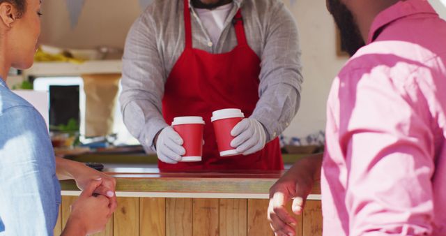 Barista in Red Apron Serving Coffee to Customers - Download Free Stock Images Pikwizard.com