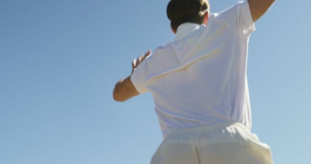 Male player in white cricket uniform throwing ball - Download Free Stock Images Pikwizard.com