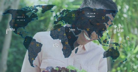 Gardener with seedling tray and digital world map overlay