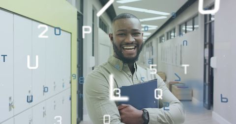 Smiling African American Teacher Holding Laptop in College Corridor