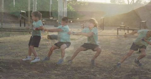 Energetic Kids Engaged in Tug-of-War at Playground