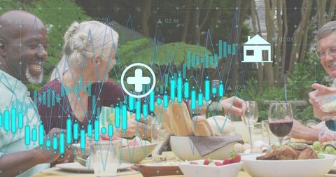 Multi-generational friends enjoying outdoor feast with financial data overlay