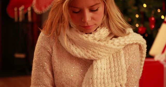 Young woman in cozy winter attire during Christmas - Download Free Stock Images Pikwizard.com