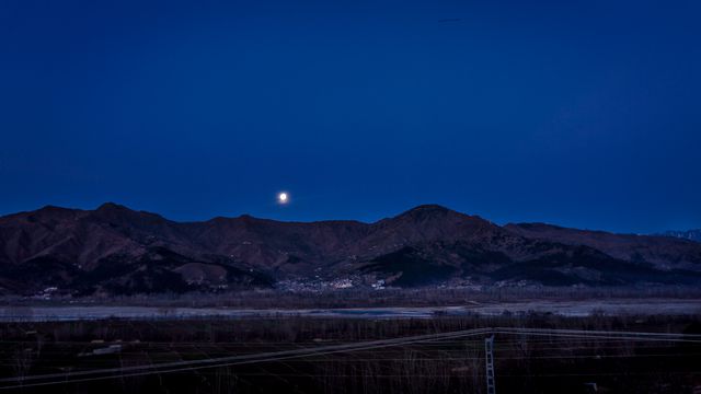 Serene Nighttime Mountain Landscape with Bright Moon - Download Free Stock Photos Pikwizard.com
