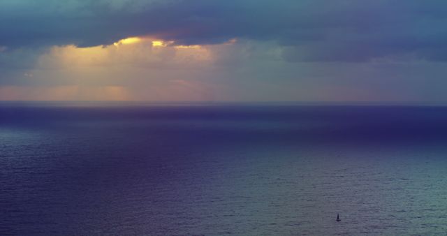 General view of seascape with sun shining through stormy clouds with copy space. Sea, ocean, nature and weather concept.