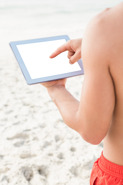 Close-Up of Man Using Digital Tablet with Transparent Screen on Sunny Beach - Download Free Stock Videos Pikwizard.com