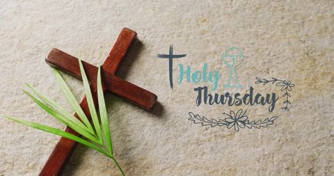 Holy thursday christian cross with palm leaf on gray surface