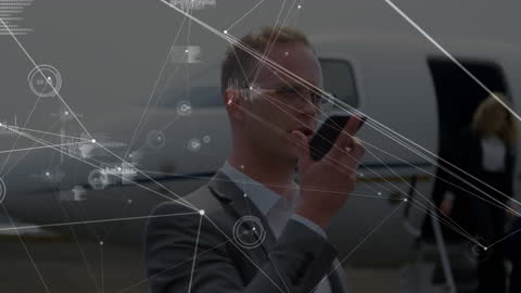 Businessman Engaged with Digital Network at Airport