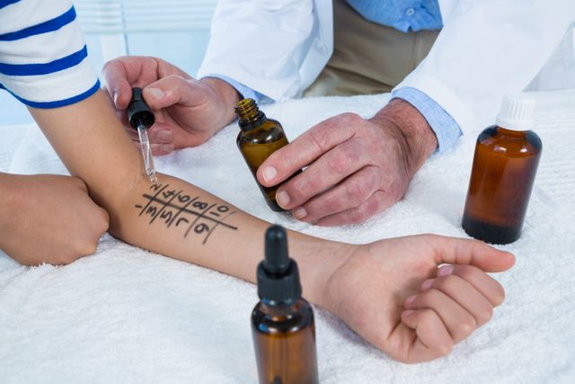 Doctor performing allergy test on skin in clinic