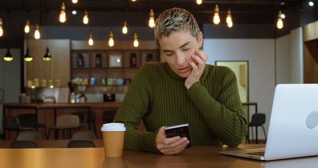 Young Man Texting in Cafe Working on Laptop - Download Free Stock Images Pikwizard.com