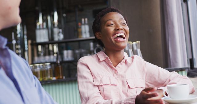 Woman Laughing While Enjoying A Coffee Break in Cafe - Download Free Stock Images Pikwizard.com