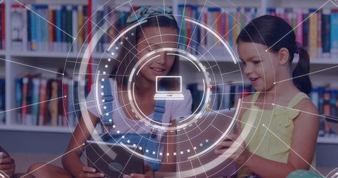 Girls using tablets in library with augmented reality hud for collaborative learning
