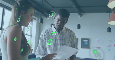 Team Analyzing Eco-Focused Data in Modern Office Environment