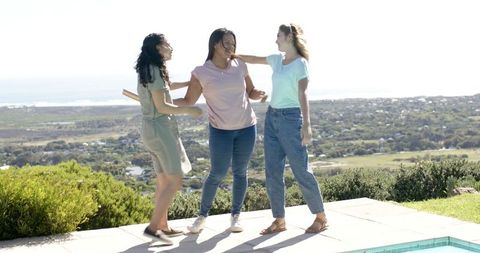 Three Friends Celebrating with Flare at Beachside Terrace