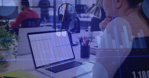 Businesswoman Analyzing Financial Data on Laptop with Graphs Overlay - Download Free Stock Images Pikwizard.com
