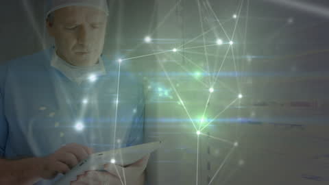 Surgeon Using Tablet with Digital Network Overlay in Hospital