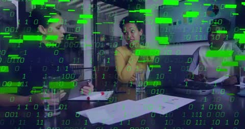 Businesswomen Analyzing Data with Binary Code Overlay