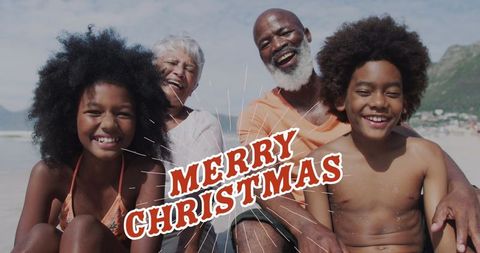 Happy Multigenerational Family Enjoying Christmas Beach Day