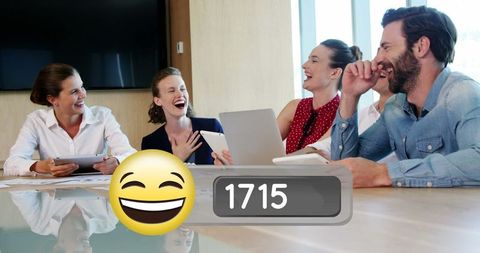 Business Team Sharing a Laugh During Corporate Meeting