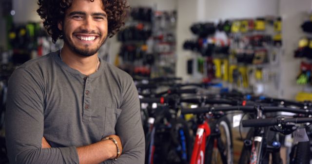 Confident Male Bicycle Store Owner Smiling in Front of Bikes - Download Free Stock Images Pikwizard.com