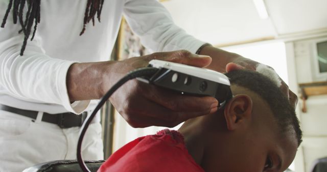 Barber Giving Boy Haircut with Electric Clippers - Download Free Stock Images Pikwizard.com