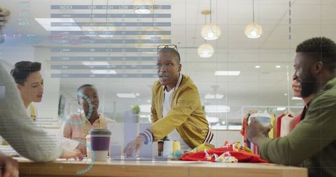 Creative designers collaborating in studio on fashion projects