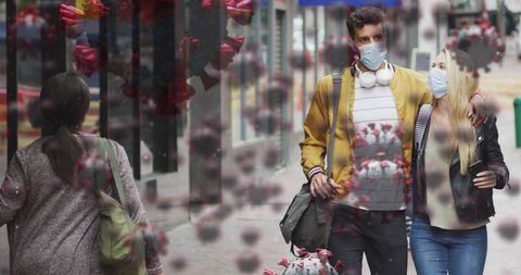 Caucasian Couple in Masks amidst Overlapping Virus Cells