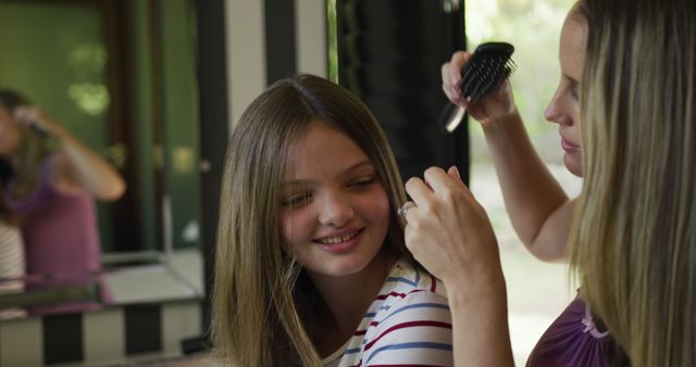 Mother Helping Daughter with Hair Grooming, Smiling and Enjoying Quality Time - Download Free Stock Images Pikwizard.com