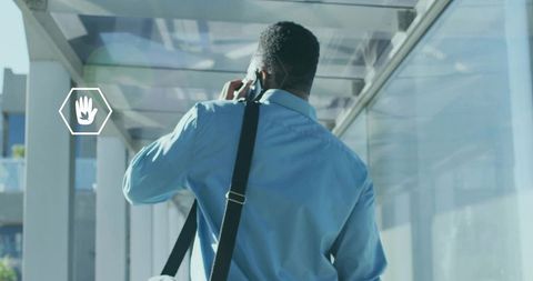 Businessman Connecting on Smartphone in Modern Urban Environment