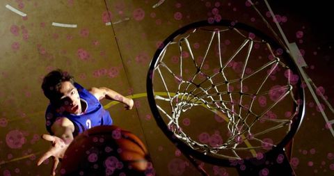 Basketball Player Shooting for Hoop Below View