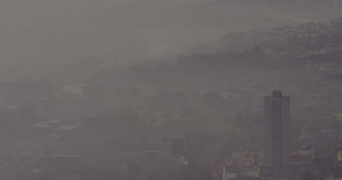 Mysterious Cityscape Shrouded in Haze and Fog - Download Free Stock Images Pikwizard.com