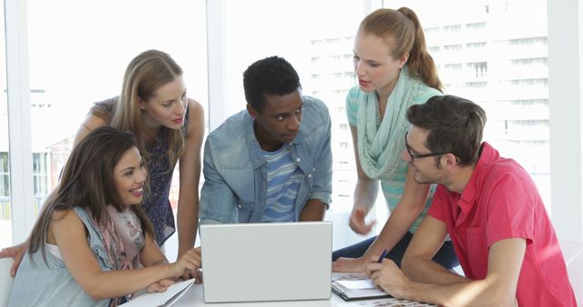 Diverse group of young professionals collaborating at work - Download Free Stock Images Pikwizard.com