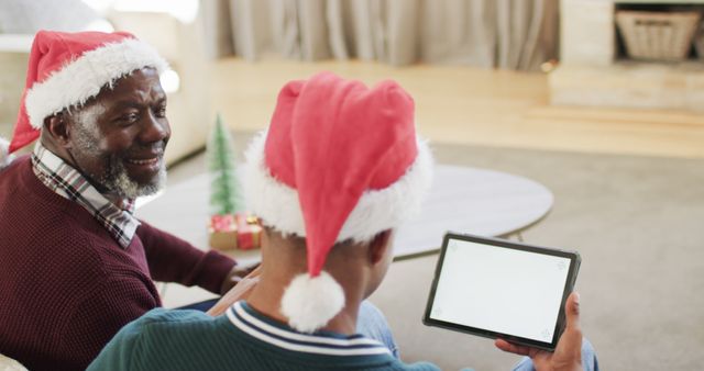 Family Celebrating Christmas Together Using Digital Tablet - Download Free Stock Images Pikwizard.com