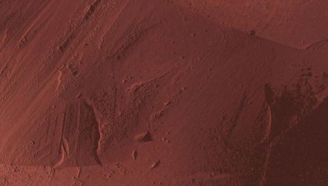 Rustic terracotta plaster texture with trowel marks, pits and weathered patina