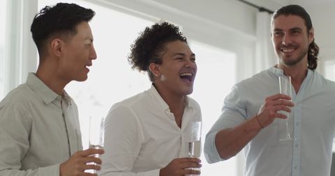 Friends Celebrating with Champagne at Wedding Reception