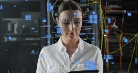 It engineer analyzing data amidst digital circuit overlay