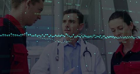 Physician briefing emts in hospital corridor with data overlay for clinical teamwork
