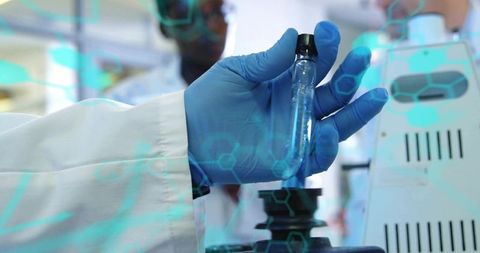 Holding vial with blue gloves in lab featuring molecular hex overlay and microscope