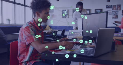 Man Analyzing Data with Holographic Digital Icons in Office