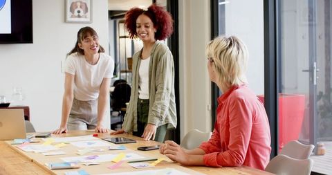 Creative Coworkers Collaborate in Modern Office Space