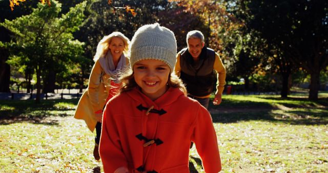 Happy Family Playing in Park Embracing Autumn Weather - Download Free Stock Images Pikwizard.com