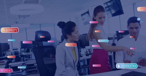 Team collaborating around tablet with data overlays and analytics tags in modern office