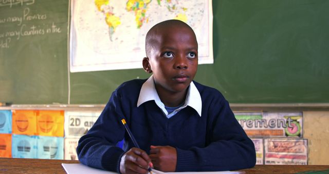 Young African Student Focusing on Study in Classroom - Download Free Stock Images Pikwizard.com