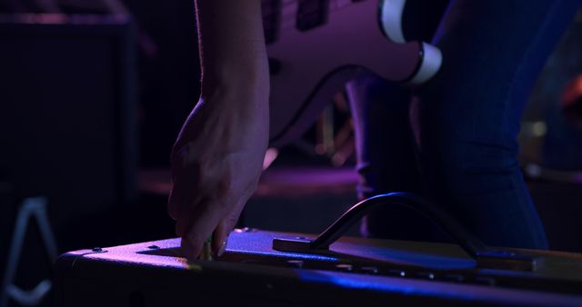 Musician Adjusting Amplifier During Live Performance - Download Free Stock Images Pikwizard.com